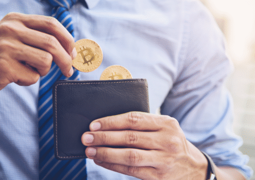 Illustration de pièces de Bitcoins sortant d'un portefeuille